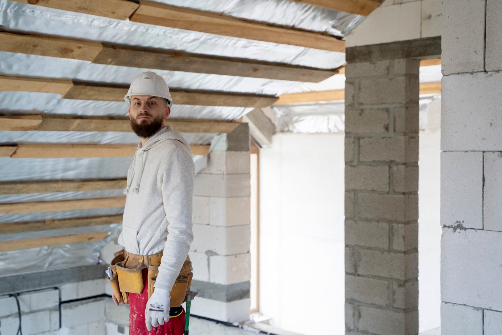 Man wearing helmet in house when renovating.