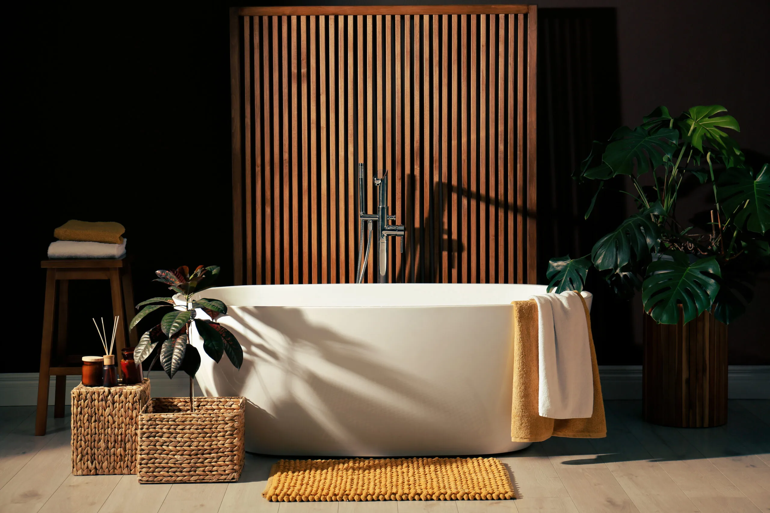 Cozy bathroom interior with stylish ceramic tub.