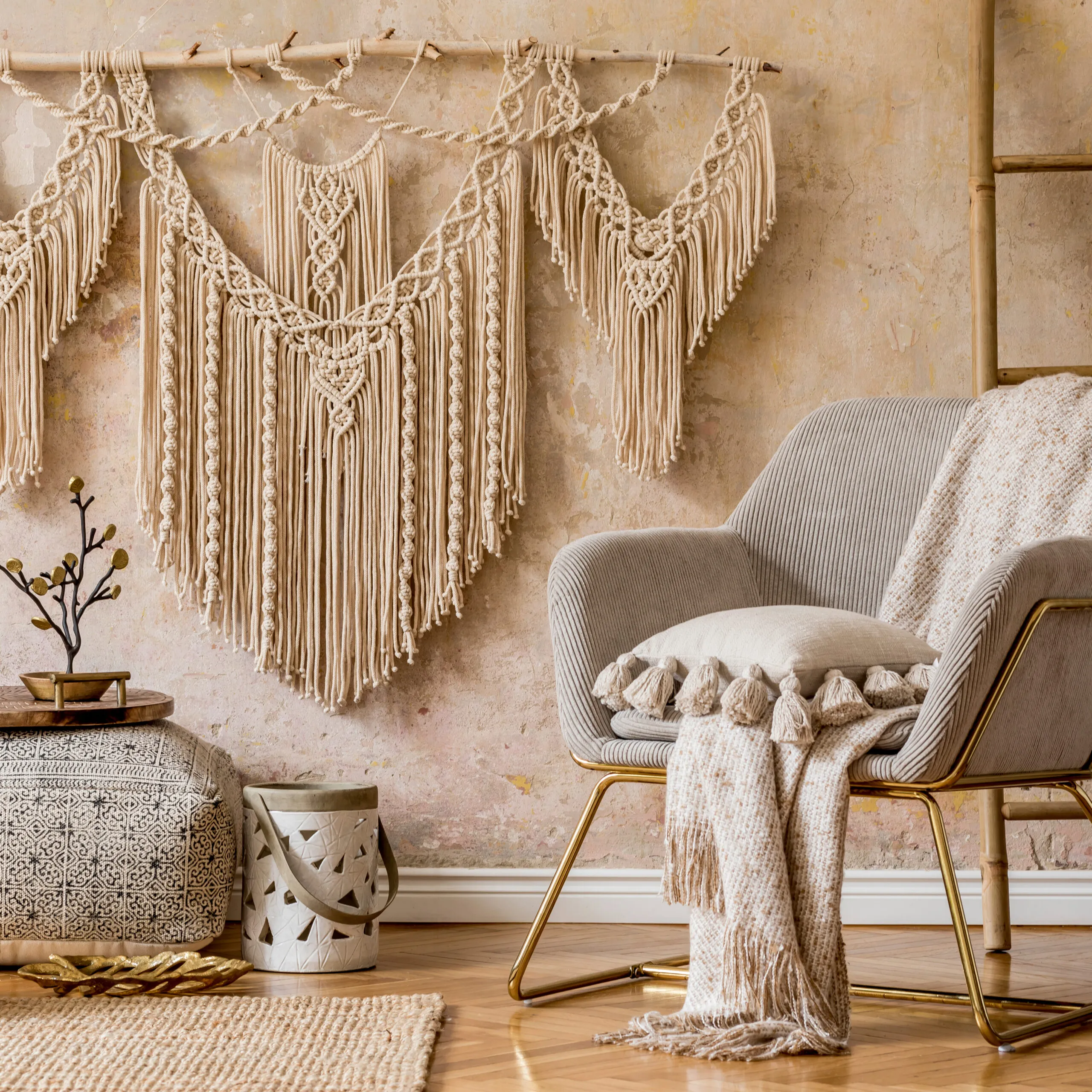 Bohemian interior design guide, living room with a chair and a tapestry.