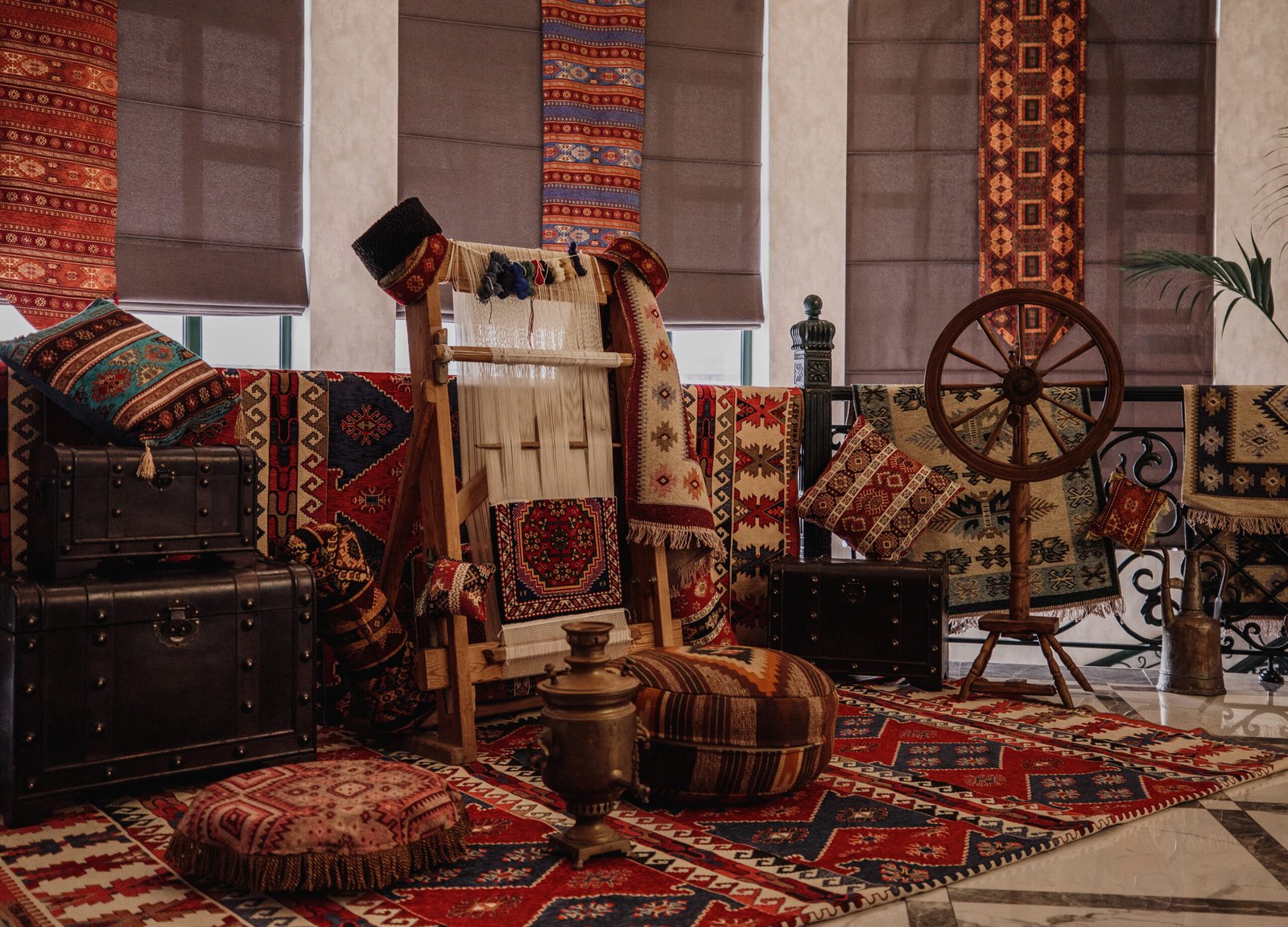 side view of a traditional rug being woven on a carpet vertical loom oriental background