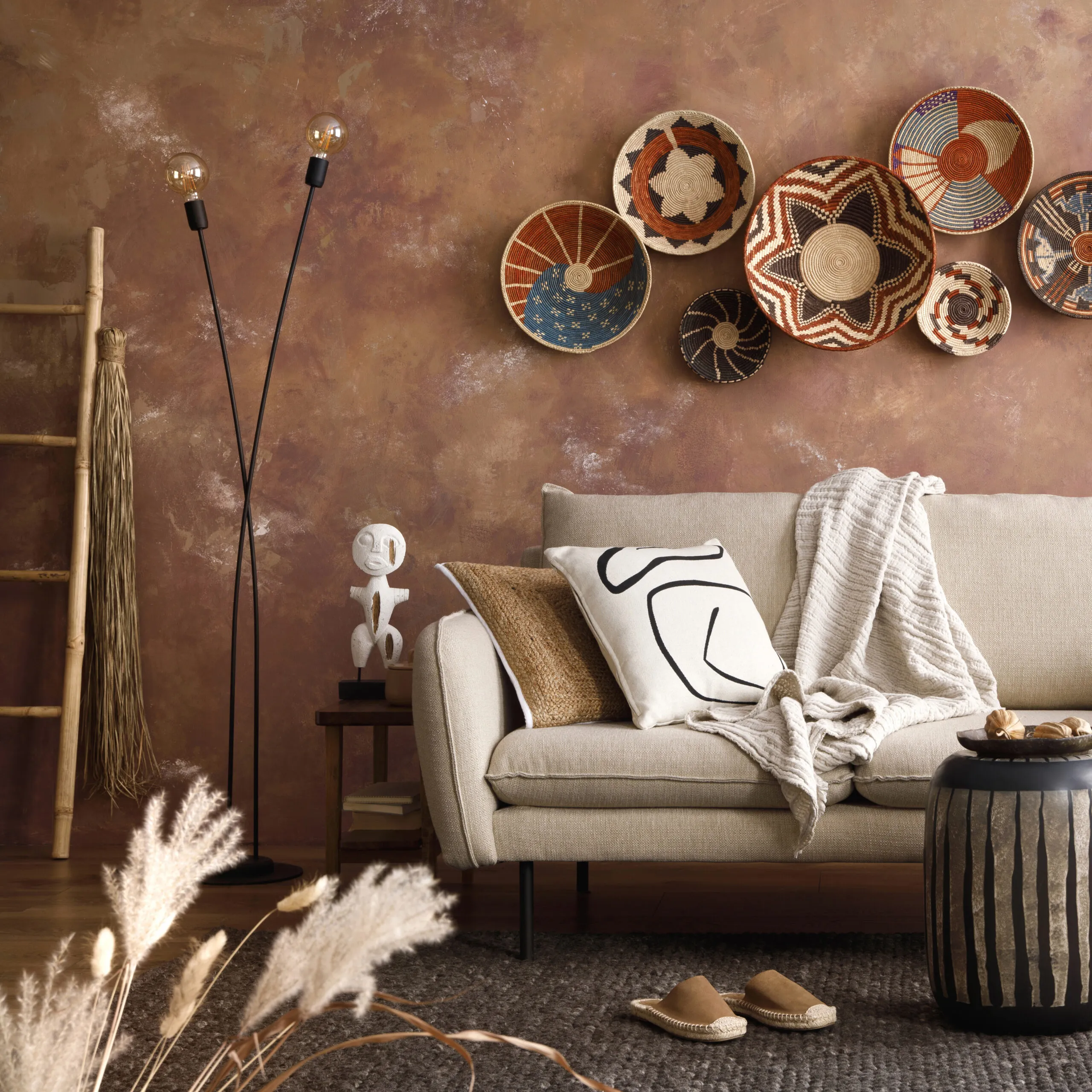 Brown and white pillows and plaid. Cozy apartment Home decor.
