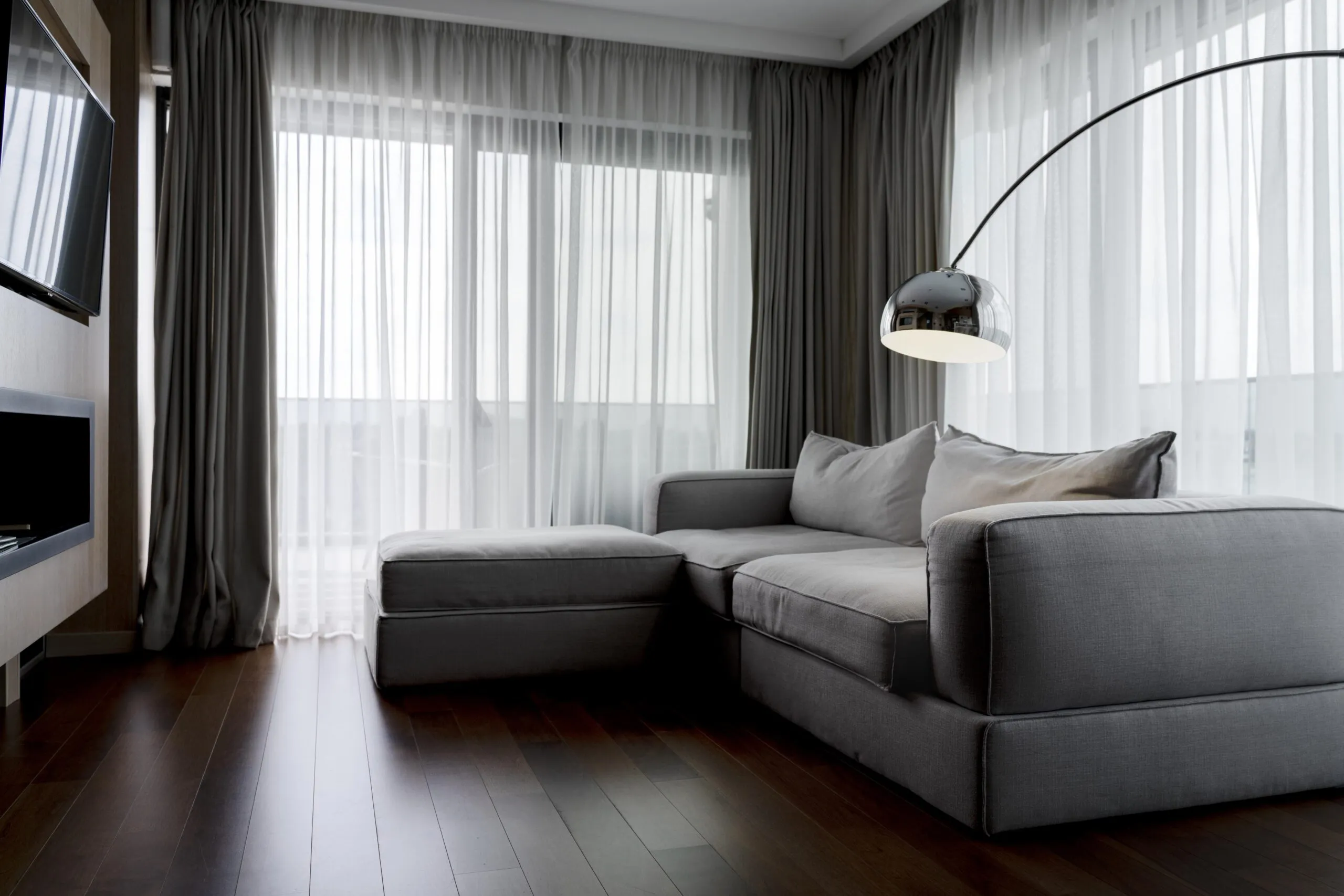 Minimalist living room with a gray couch.