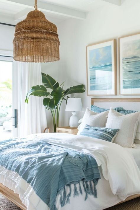 Coastal bedroom with a big plant and a rotting lamp.