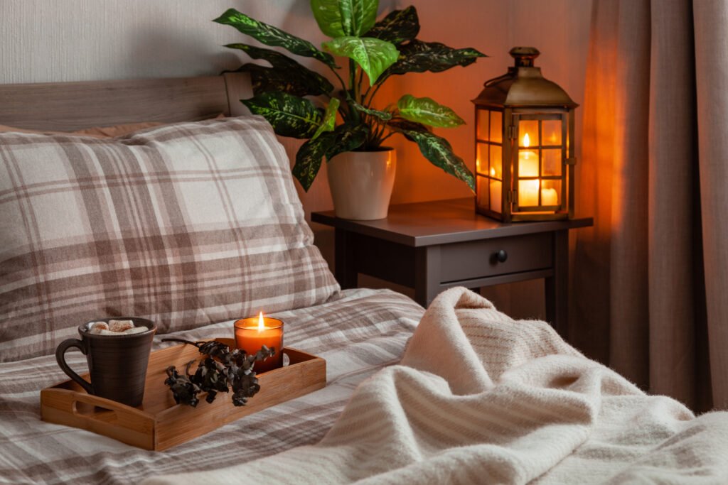 cozy scandinavian bedroom interior in natural tones, blanket lantern houseplants.