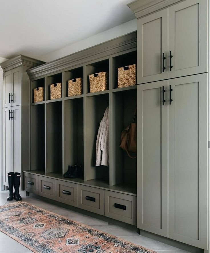 Green built in storage in mud room. 