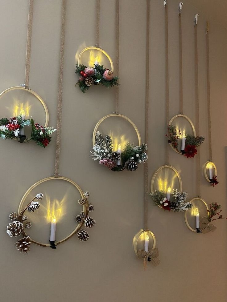 Decorated candles on the wall with Christmas decor.