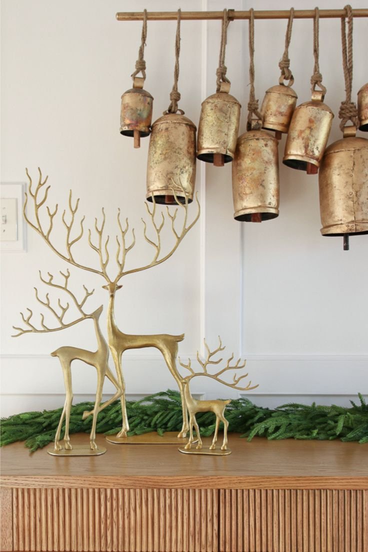 Golden Christmas decor, raindeers and bells. 