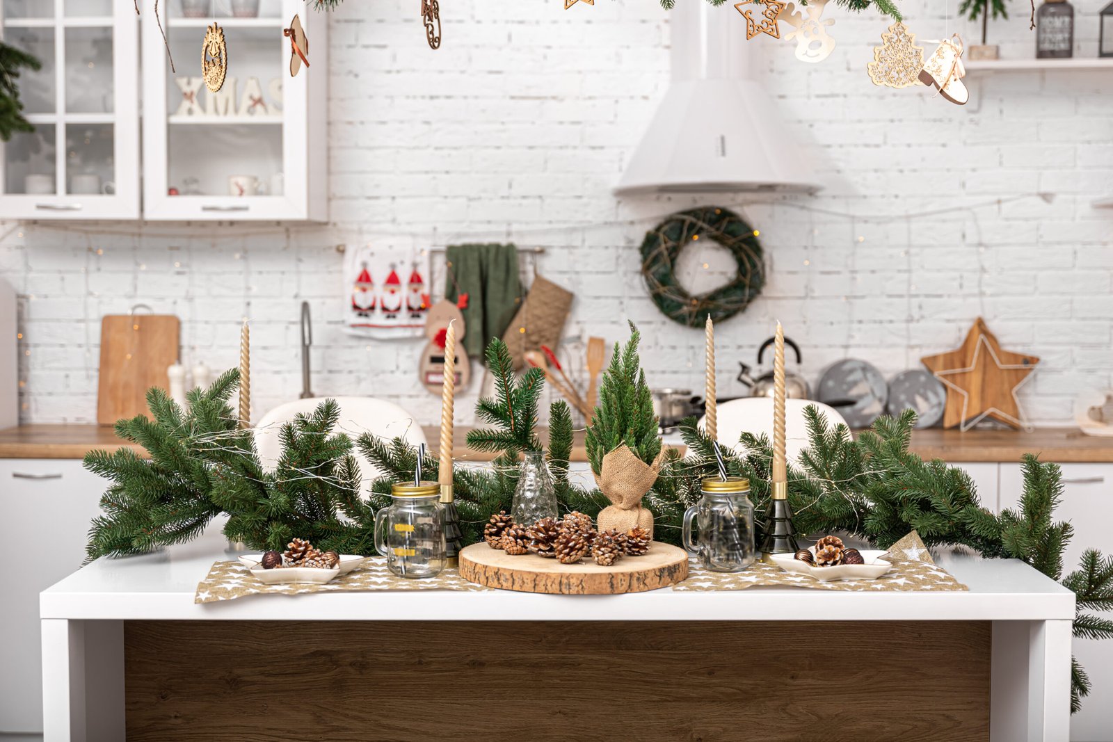 Bright modern kitchen decorated for Christmas with lots of decorative details.