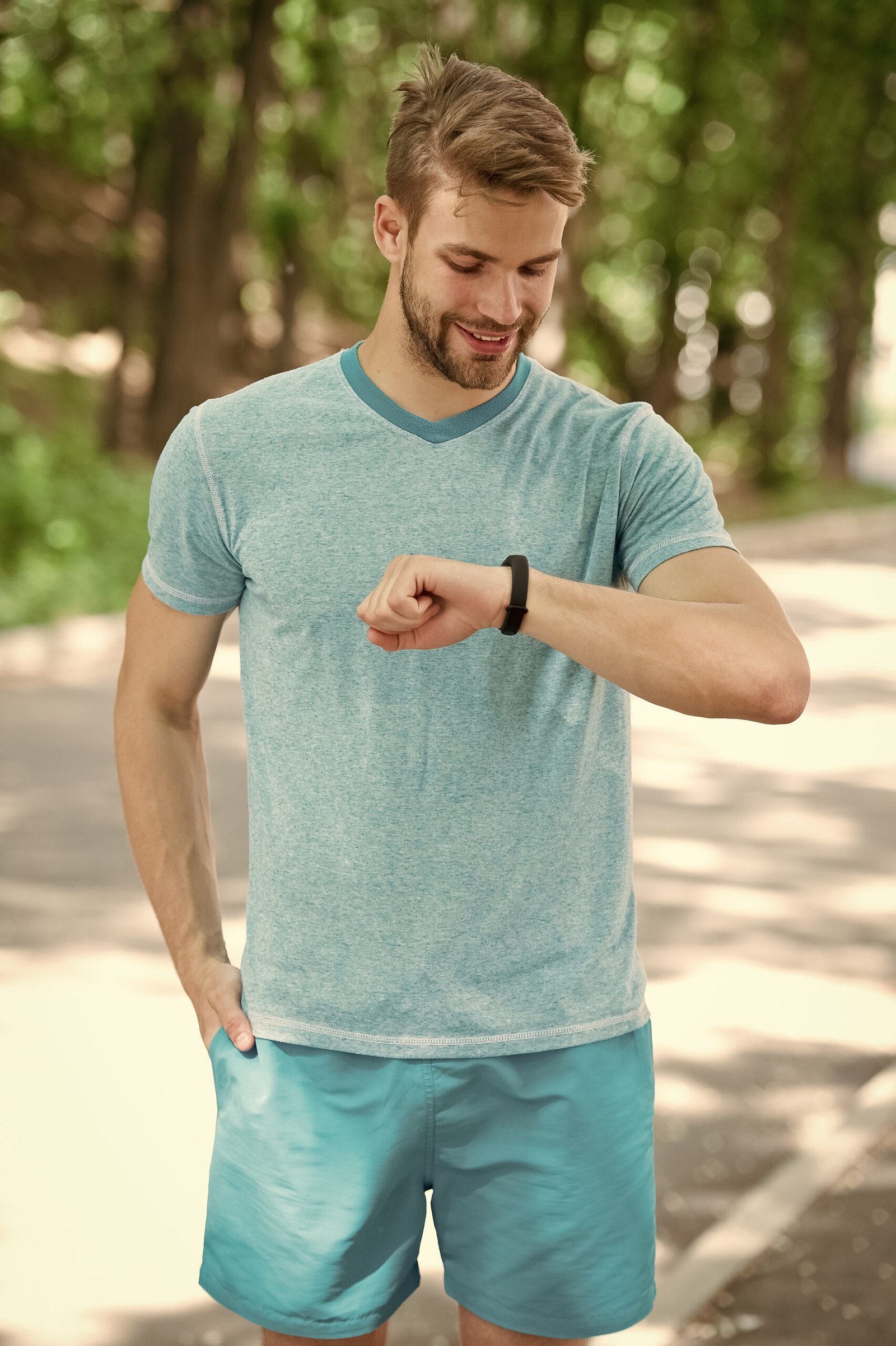 Best for training. Sportsman tracking his training with a sports watch. 