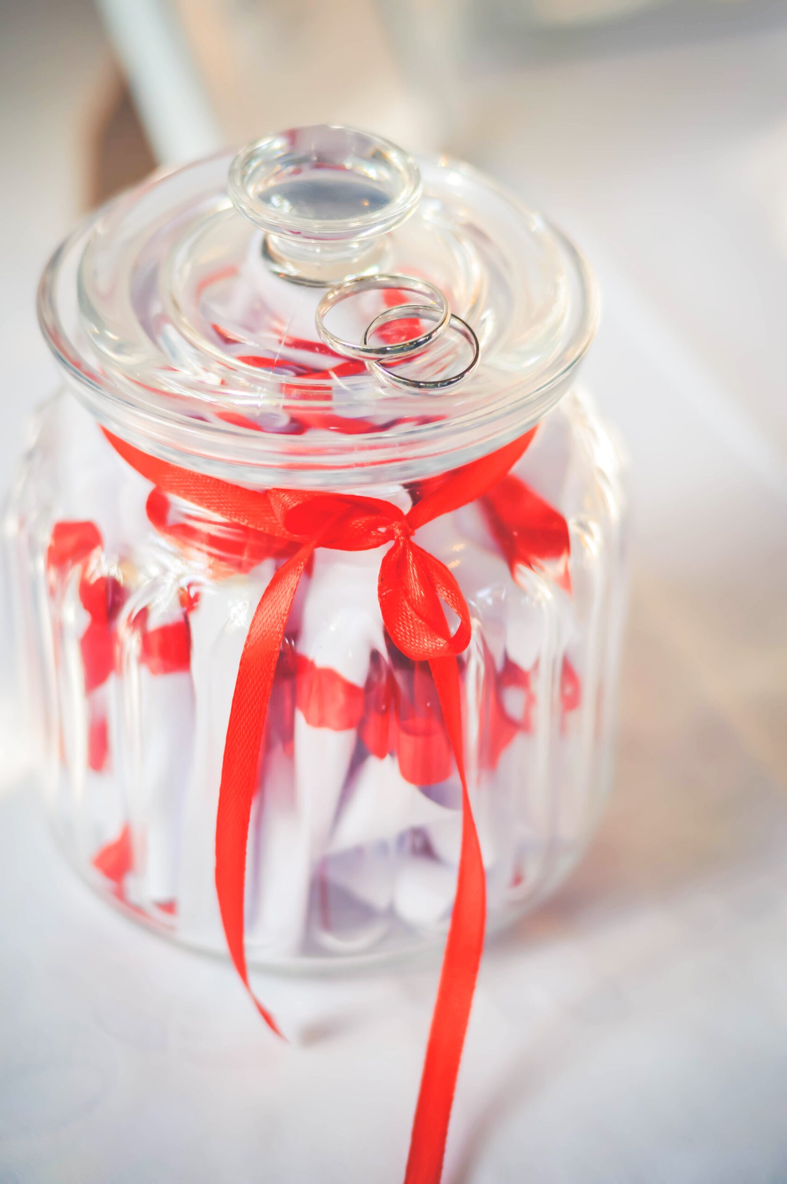 Close up on a jar with notes in it.