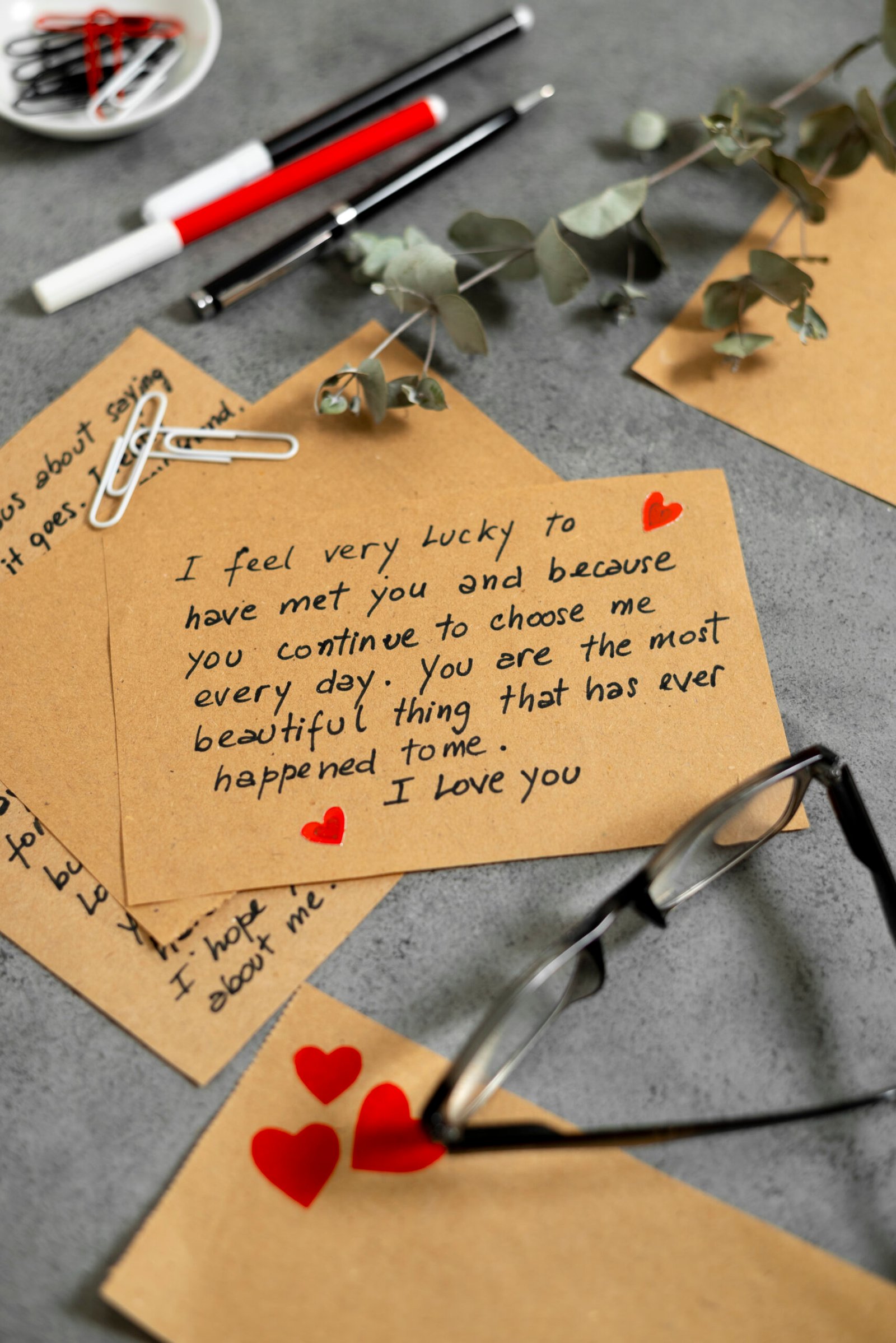 Love letter note with collection of romantic stationery. 