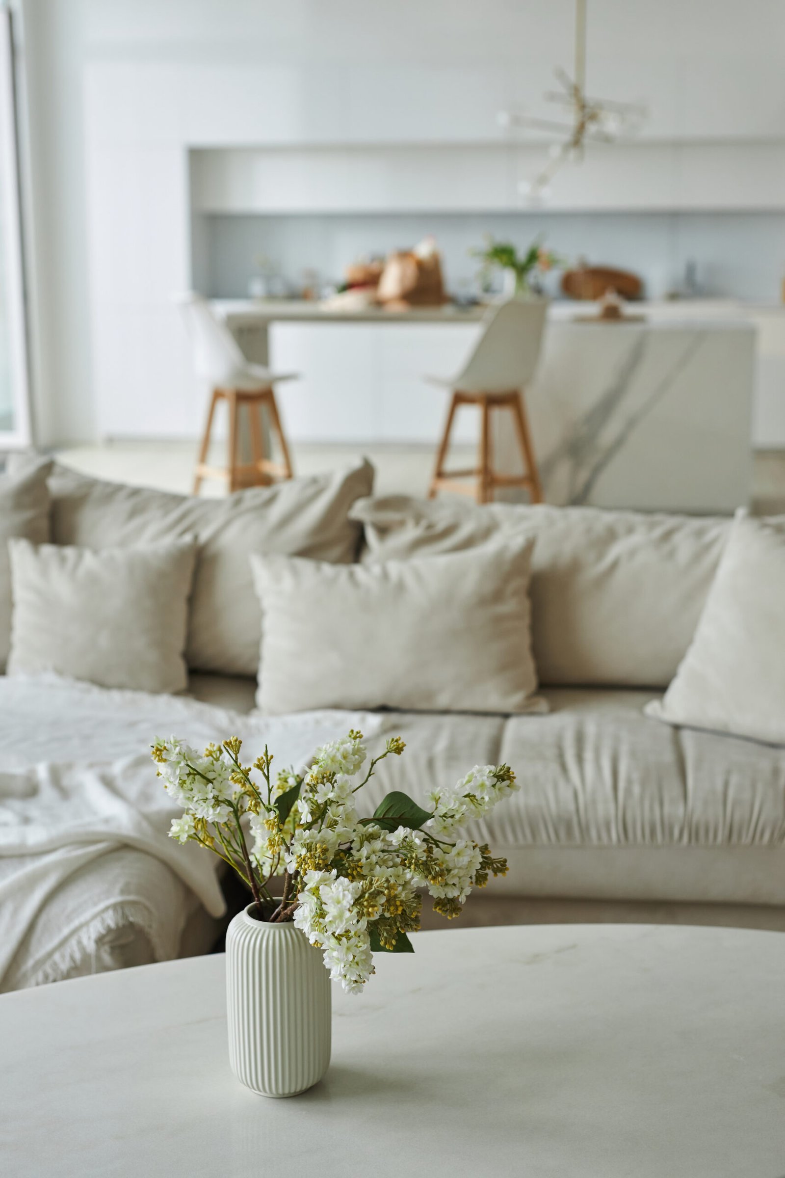 Vertical image of modern living room with beautiful flowers in vase