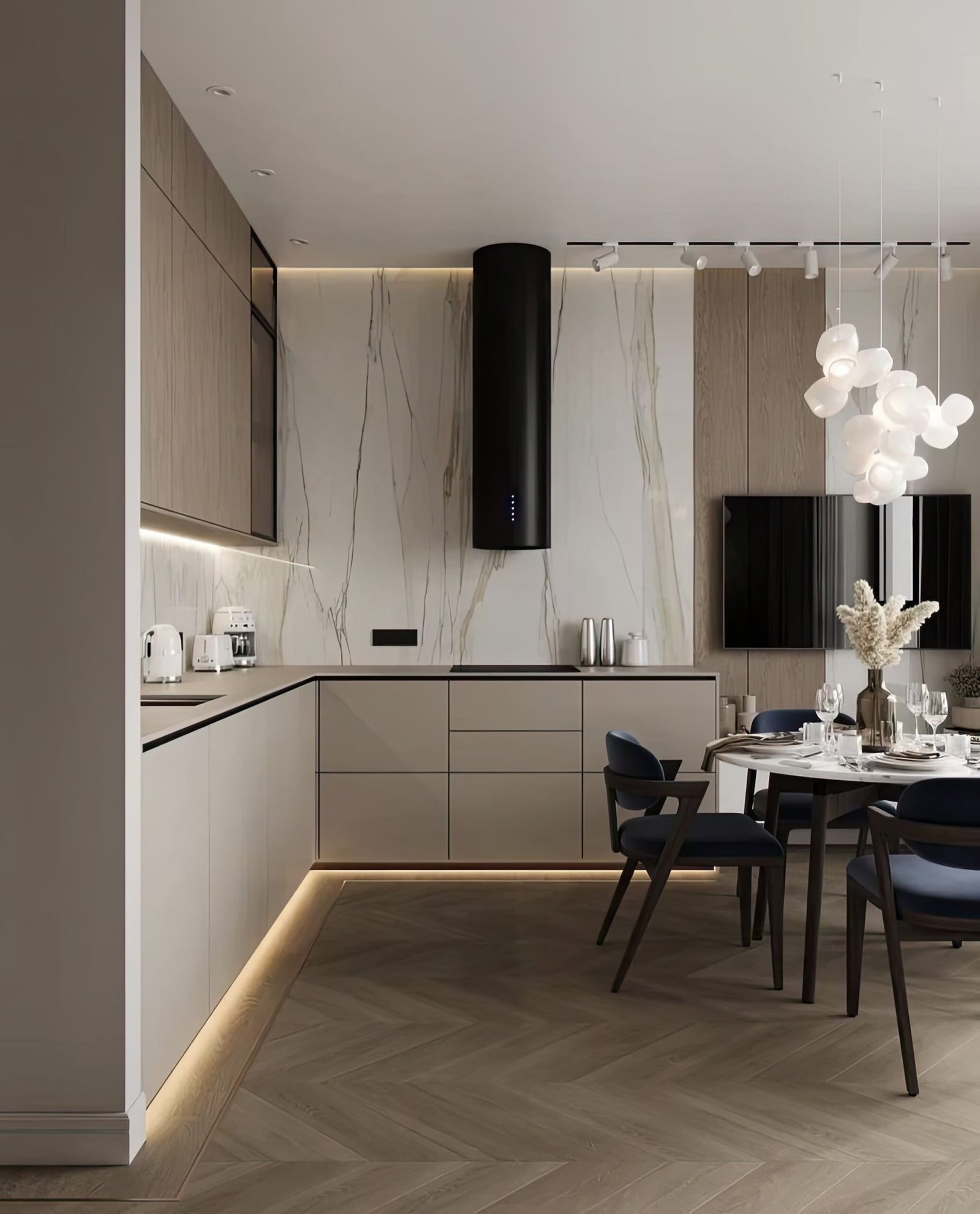 Japandi kitchen with black and white table chairs, white table with black and silver microwave. A large ceiling lamp above the dining table.