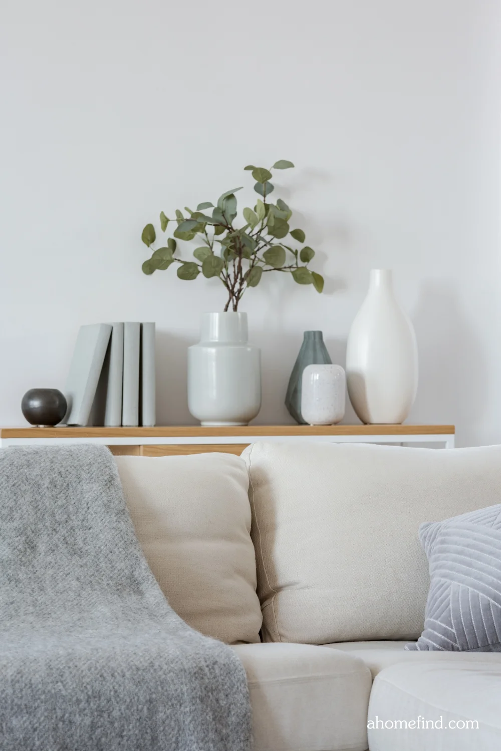 minimalist apartment decorating with neutral colored sofa and decorations. Scaled. 