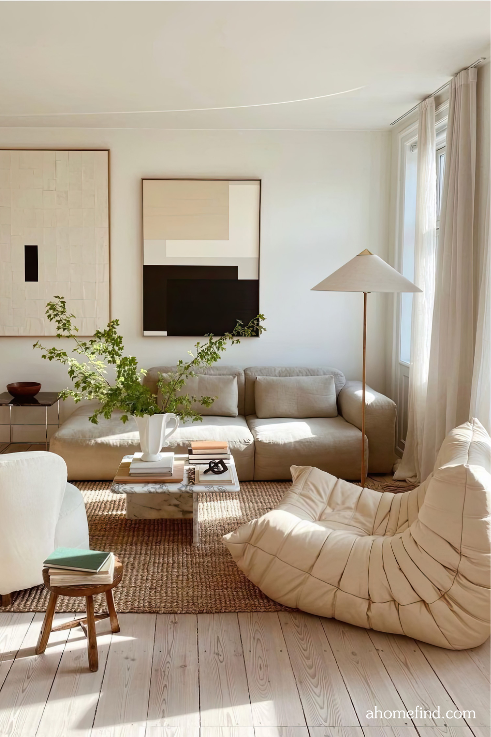 A cozy japandi living room with different textures, a coffee table, an armchair and a couch. 