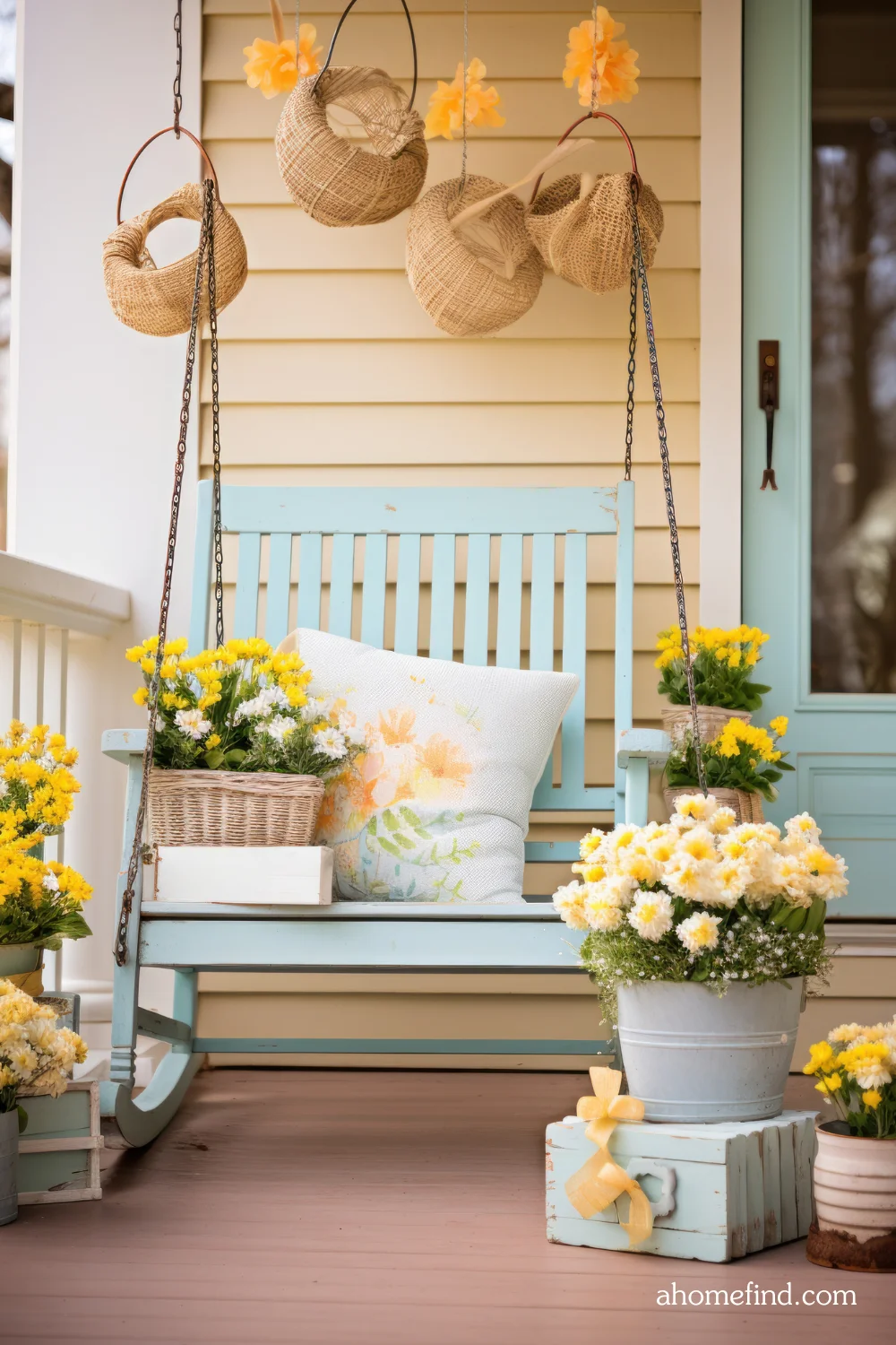 Outdoor seating ideas for spring with Floral front porch arrangements. A hanging chair. 