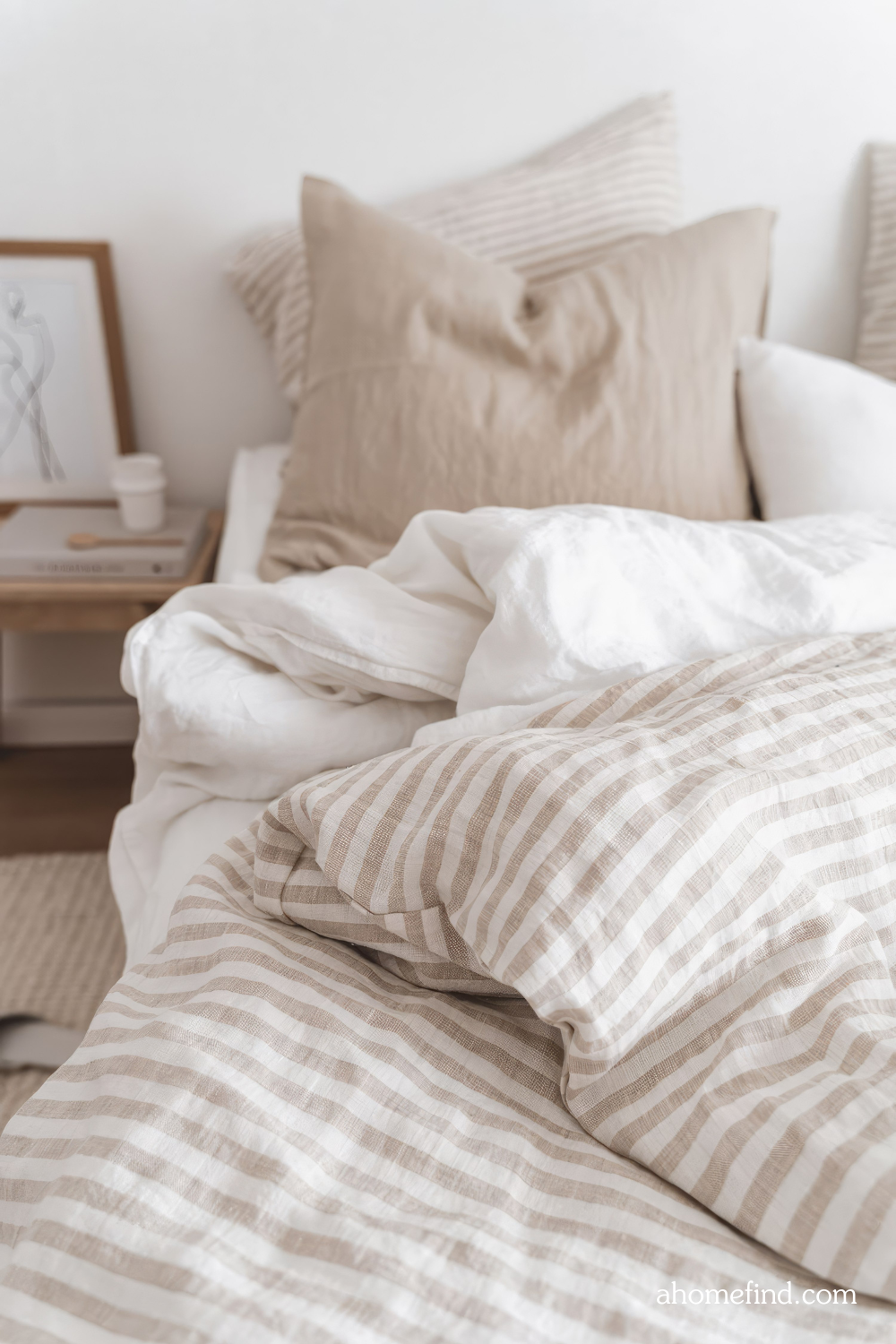 Striped linen perfect bed sheets in neutral bed with neutral bedding. Scaled. 