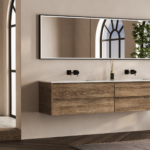 Minimalist bathroom with wooden vanity and a large mirror.