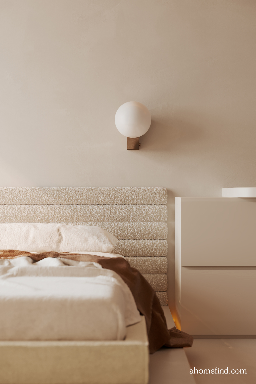 Small bedroom decorating tips and Maximize small bedroom space with a large bed and a bedside table. Beige colors and a wall lamp. 