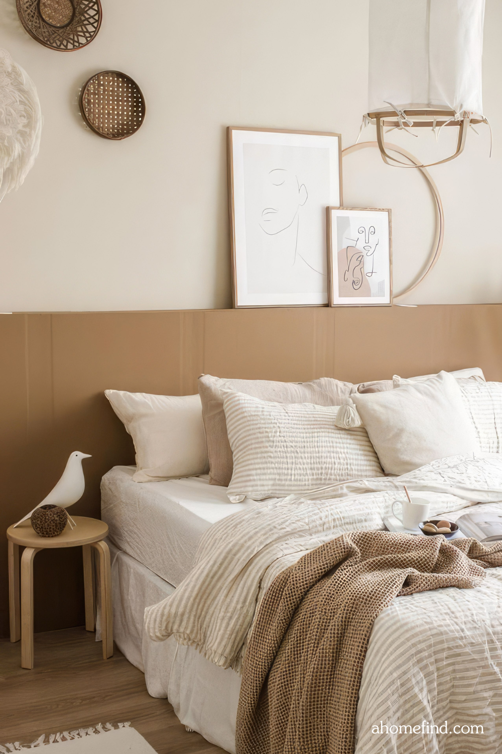 Minimalist bedroom decor and Space-saving bedroom ideas. A bed and some wall art, cozy bedding and details in decor. 