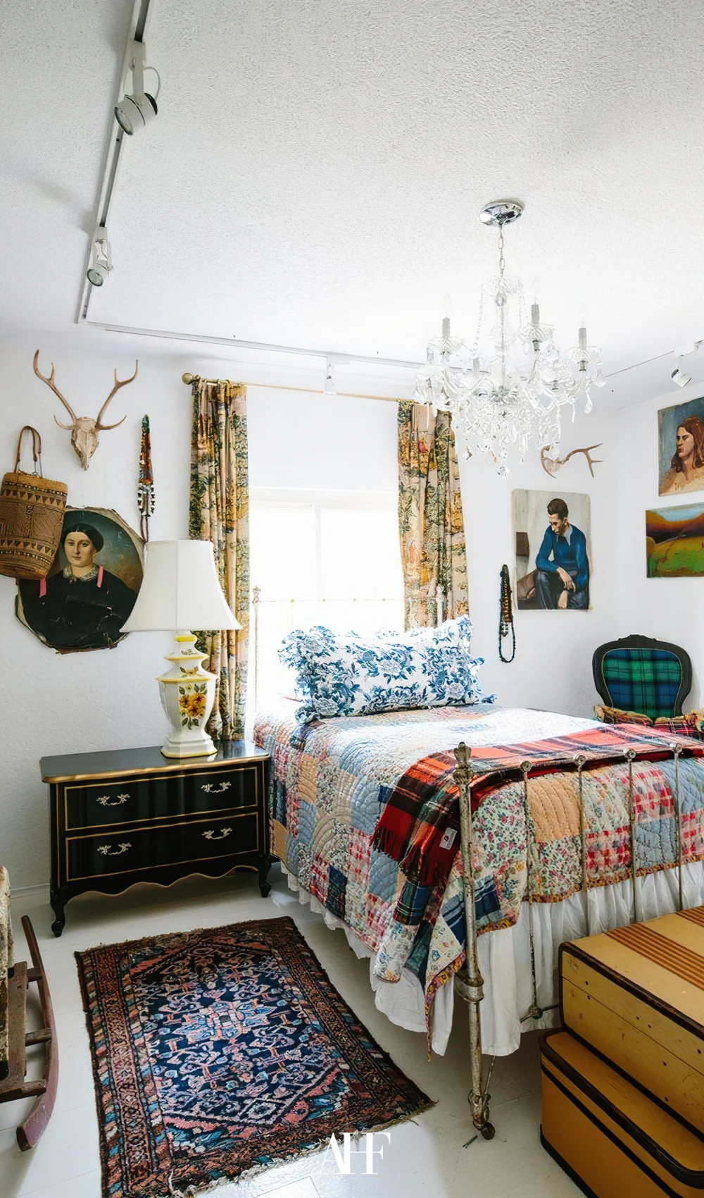 A maximalist bedroom with blue pillow, maximalist interior design and bold interior design.