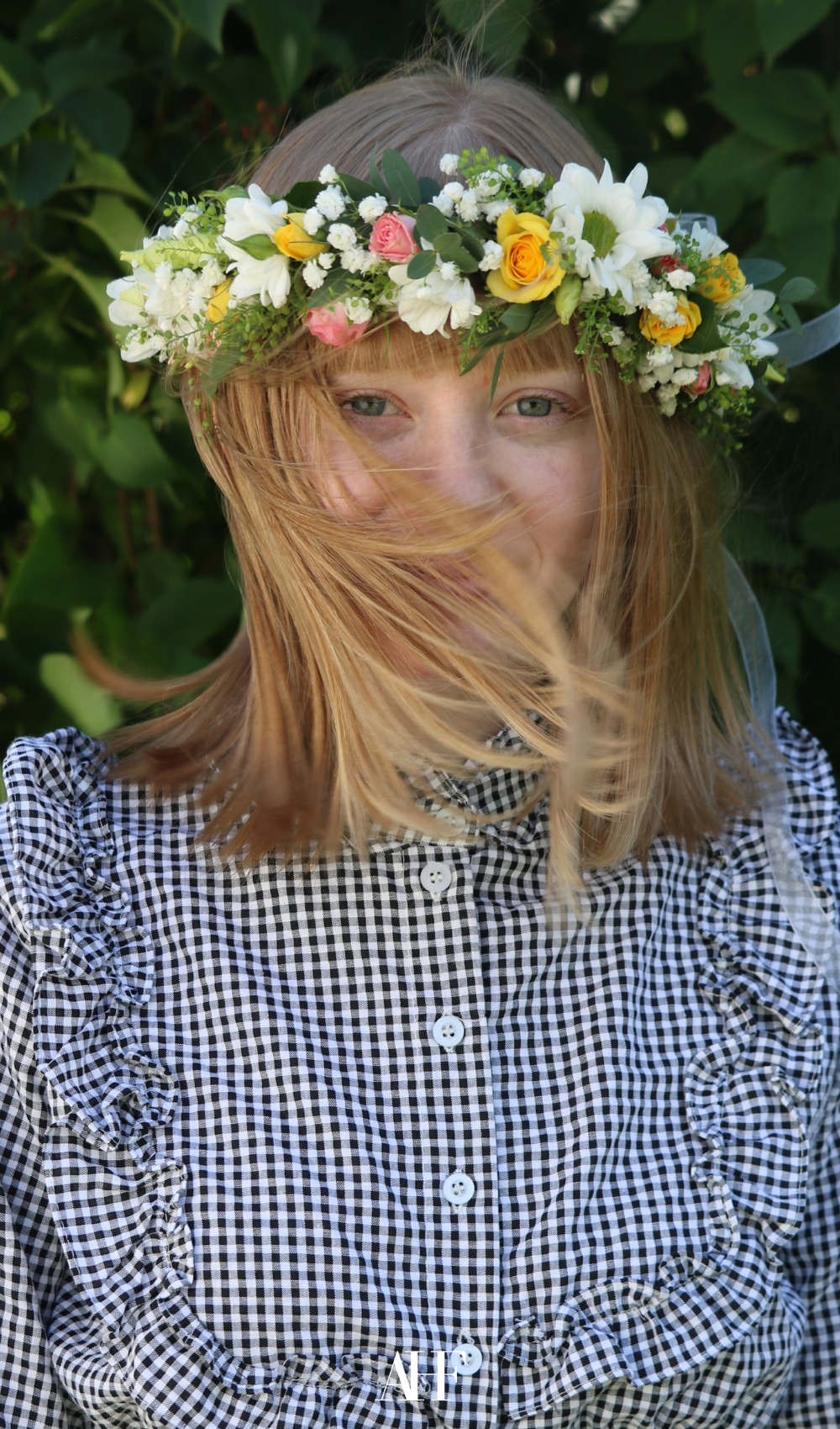 A girl with a swedish midsummer floral crown on her.