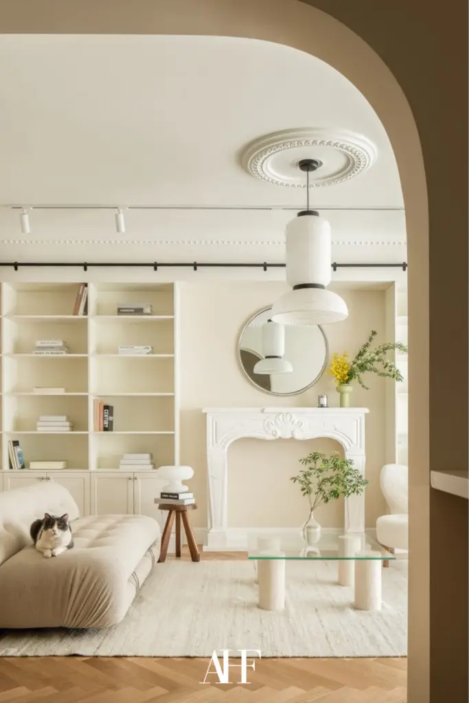 Interior design styles in a light and neutral color palette. A white sofa and a white rug. Scaled.
