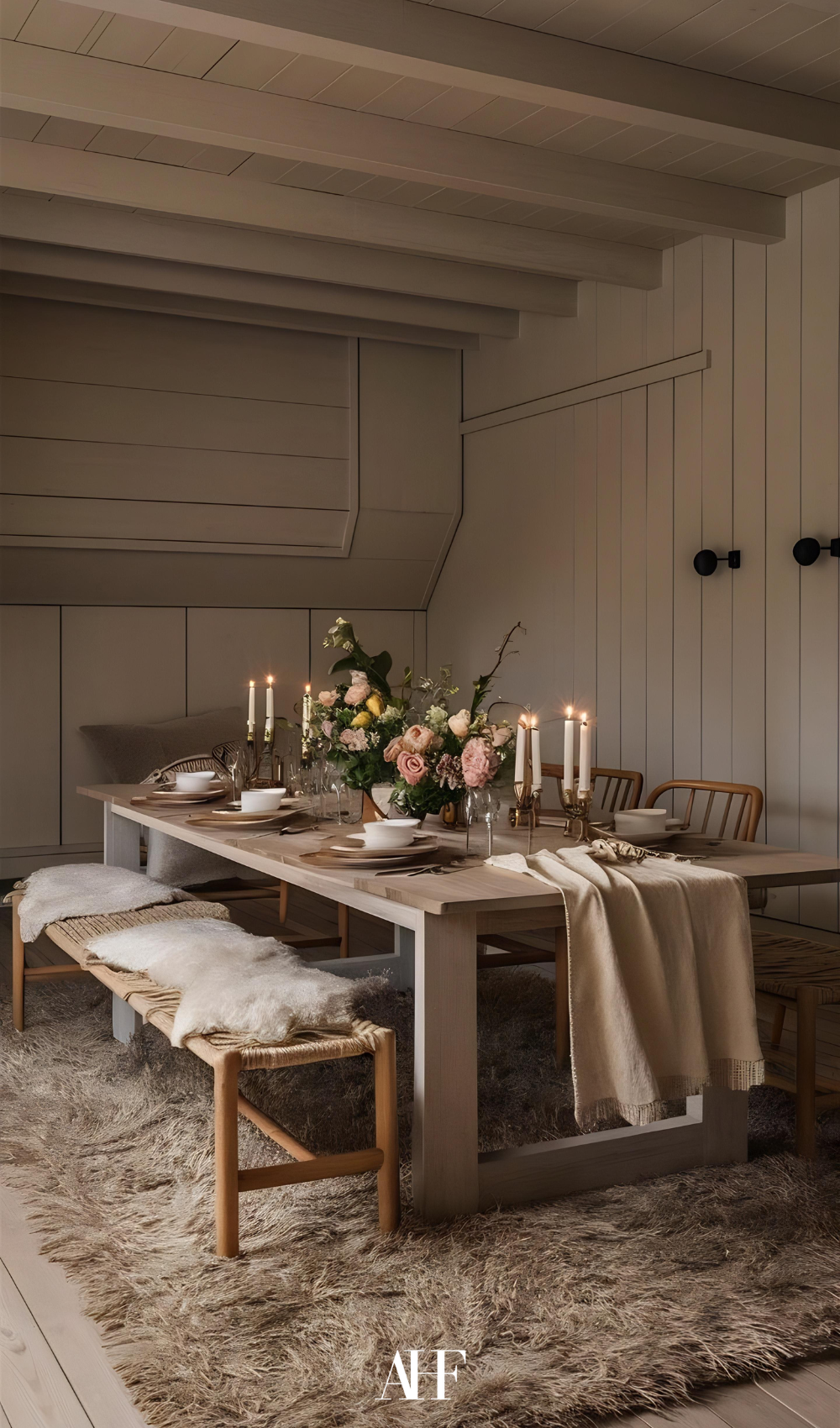 A dining table in wood, with a bench and a cozy perfect rug. 