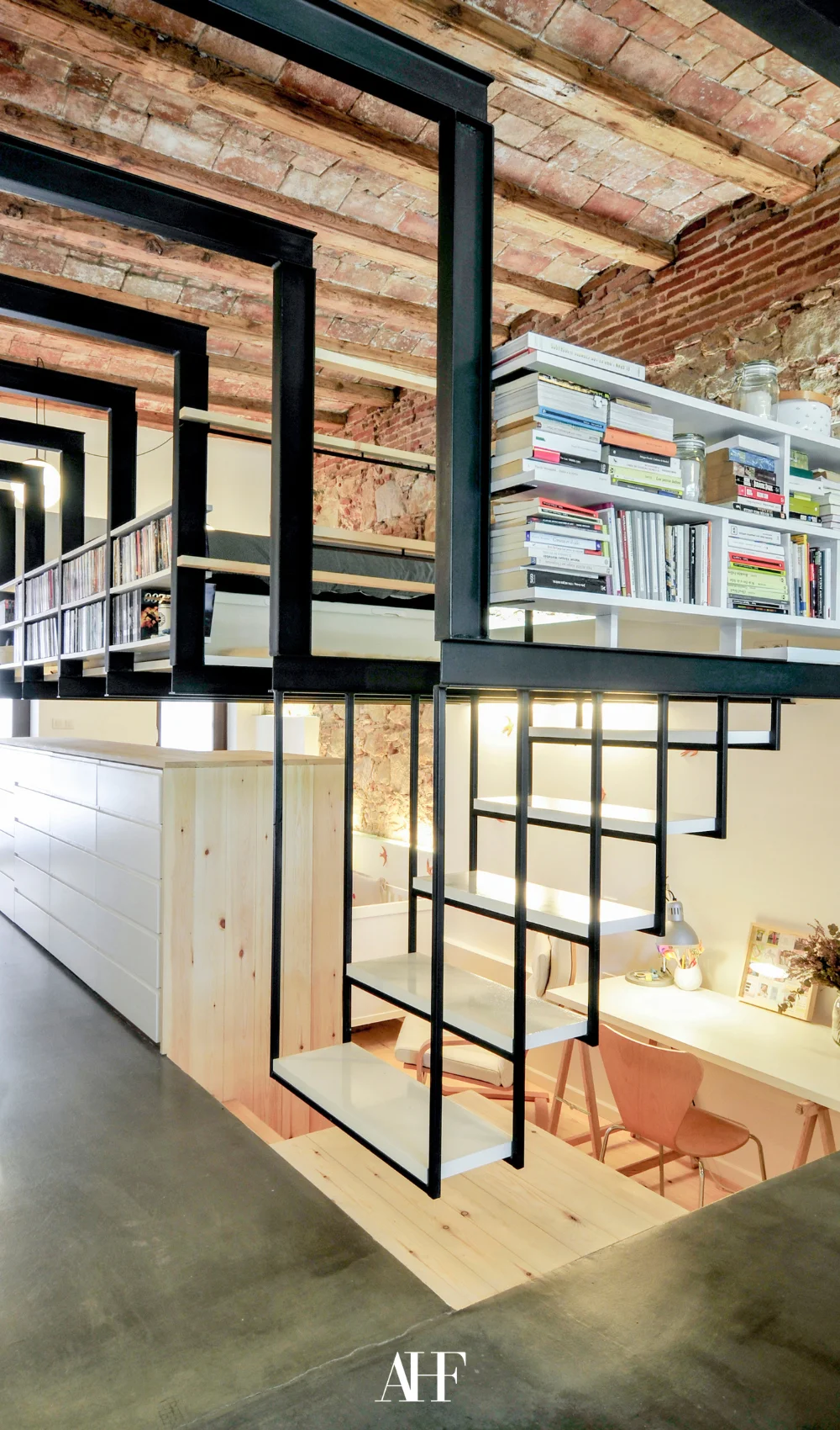 A beautiful loft in industrial interior design style with exposed black beams and wooden details.