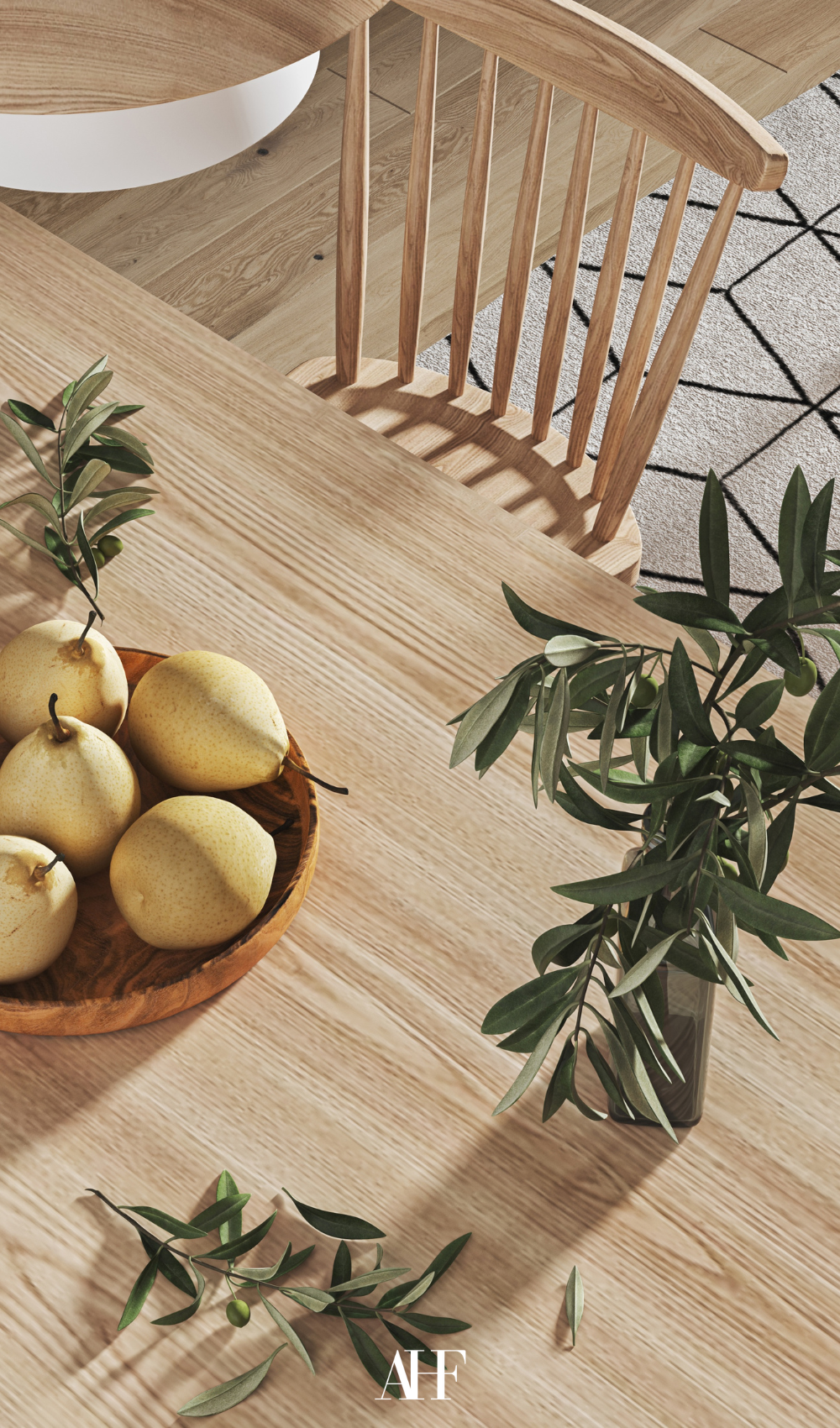 A picture from above, a light wooden dining table with a dining chair. A wooden plate with pears on the table and some greenery. 