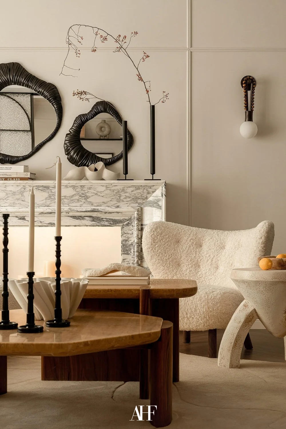A beautiful vintage minimalist interior with a white armchair, a wooden coffee table and beautiful vintage interior design details.