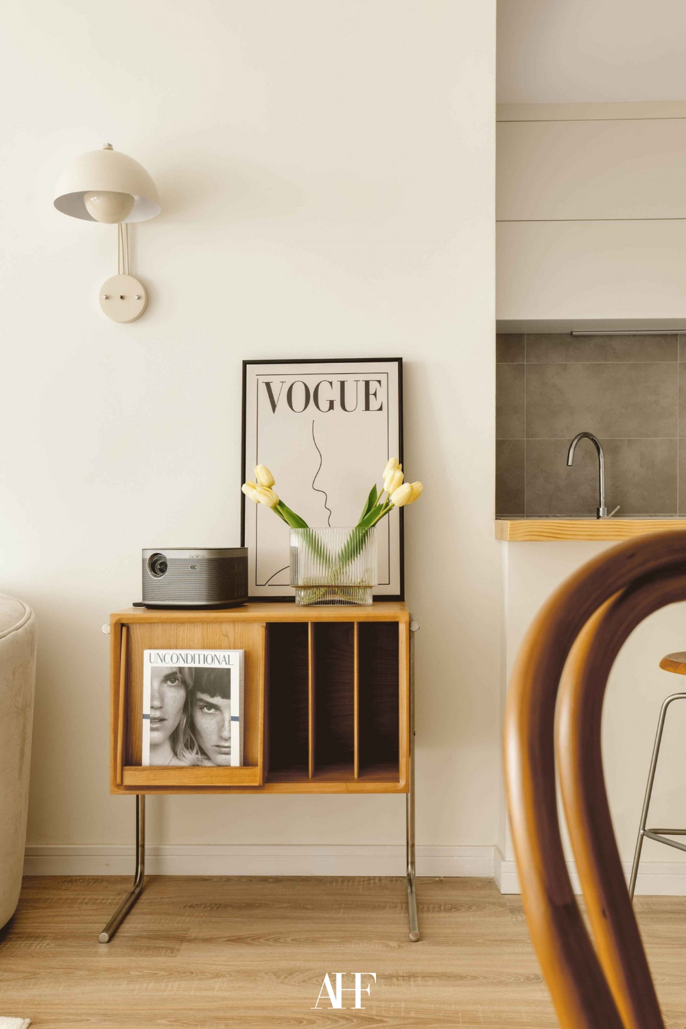 A beautifully styled sideboard in a mid century modern interior design style.