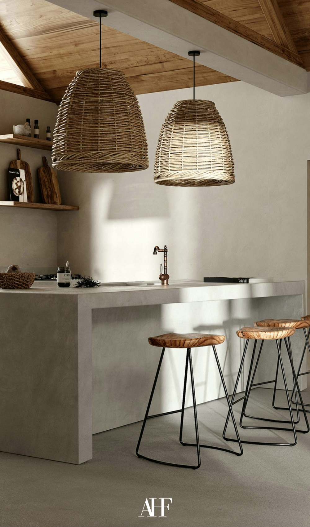 A japandi kitchen with neutral materials and colors. Japandi kitchen accessories with a kitchen island and wooden chairs.