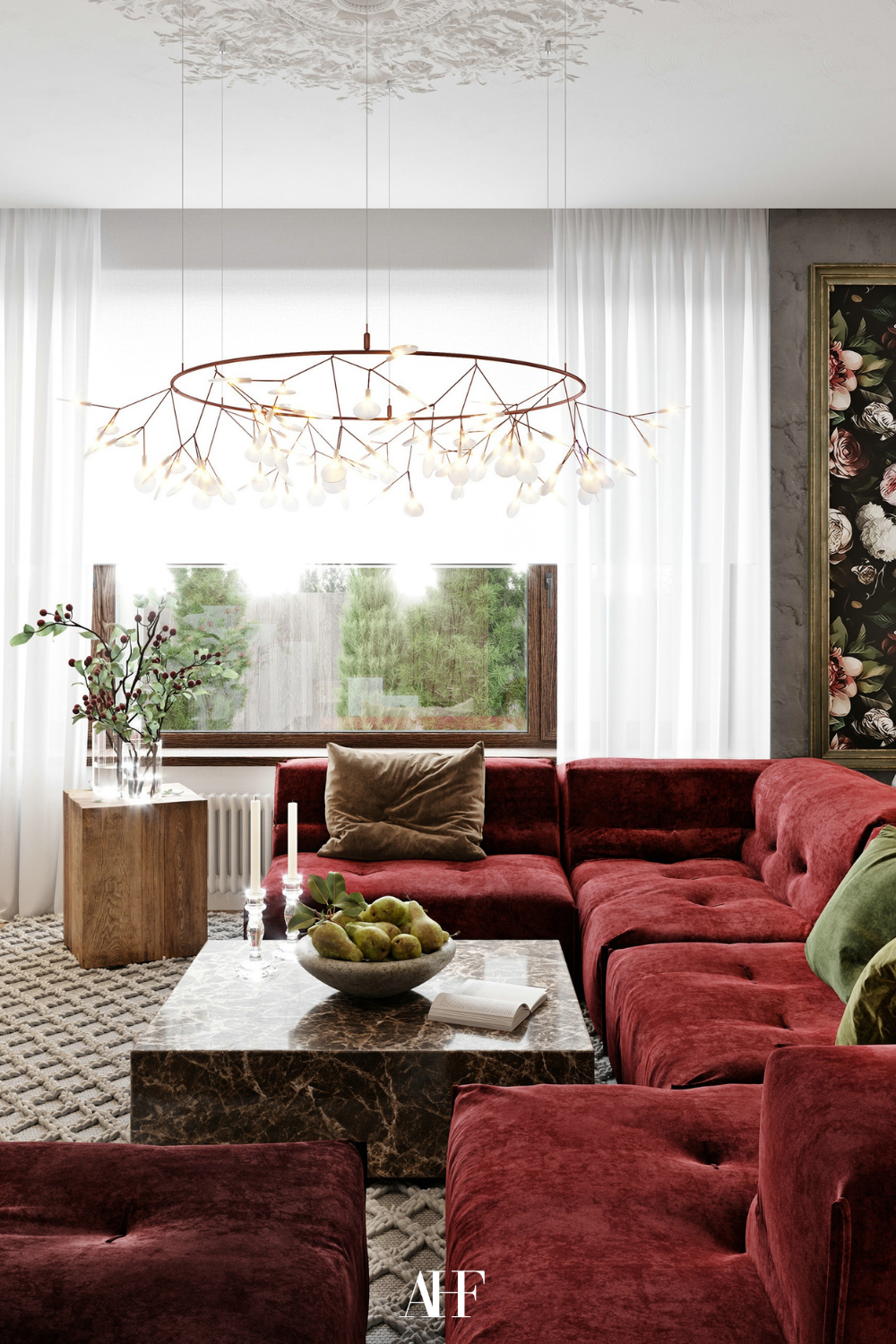 Cherry red coded living room with a cherry red sofa and a marble coffee table. Green and wooden details. 
