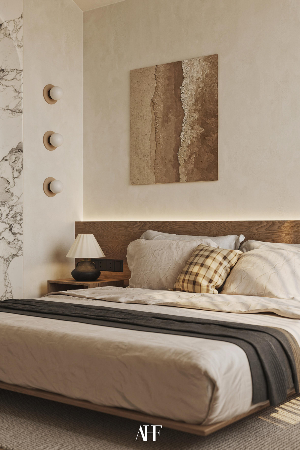 Japandi bedroom ideas with a large bed and white bedding with a grey blanket. Wooden wall panel. A bedside table with with a table lamp on. A wall art above the bed.
