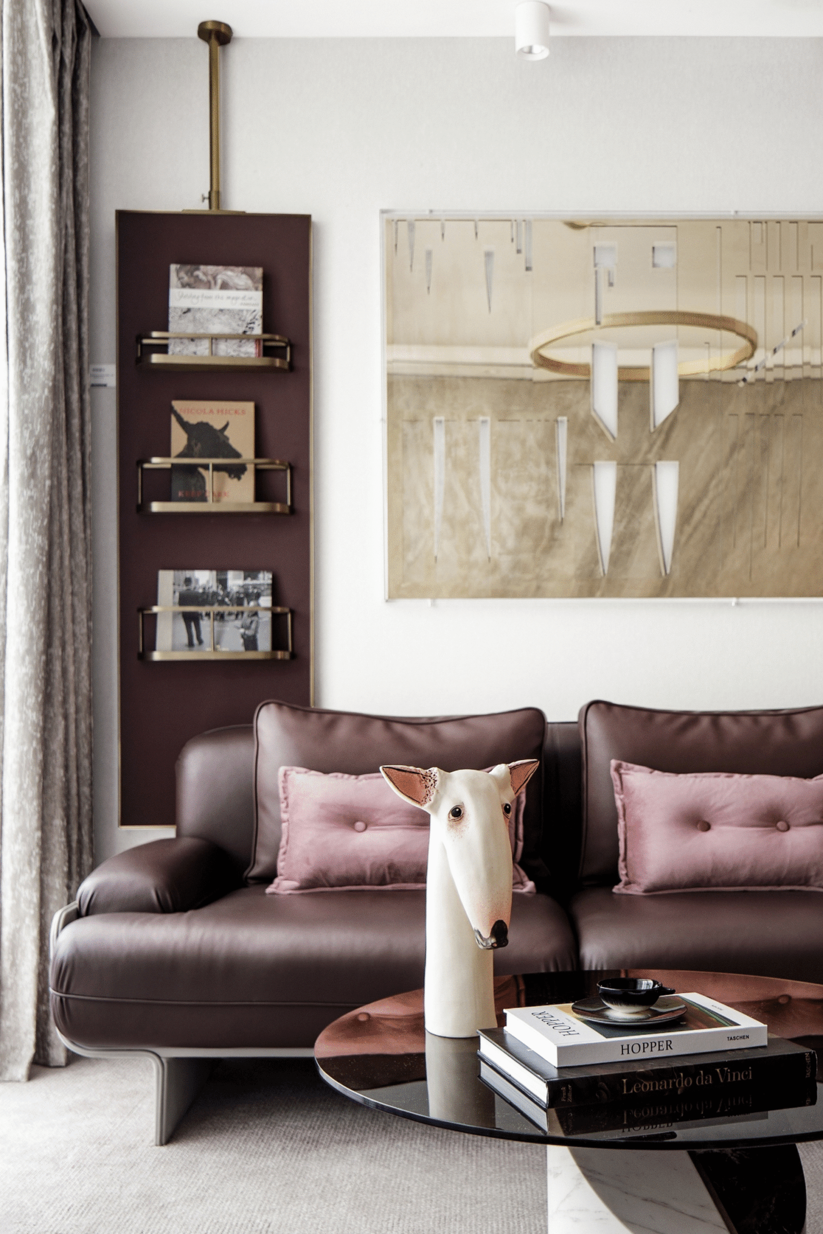A colorful living room with burgundy sofa and funny decor. Modern interiors.
