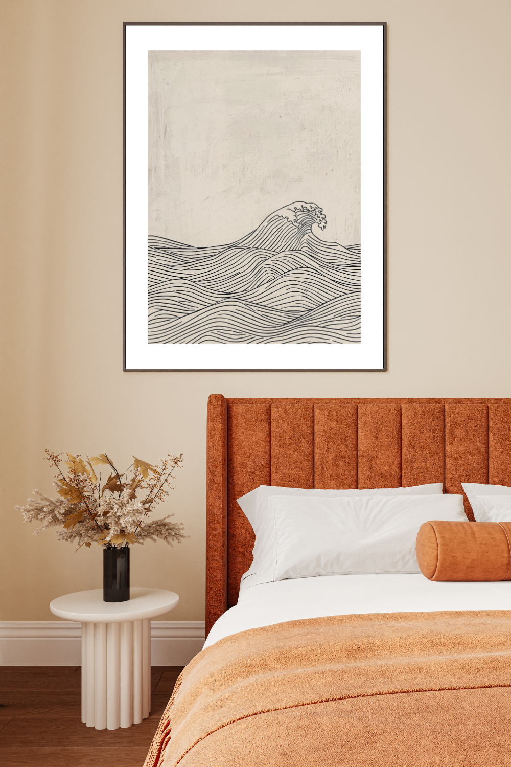 A beautiful bedroom with an orange bed frame and a neutral wall.