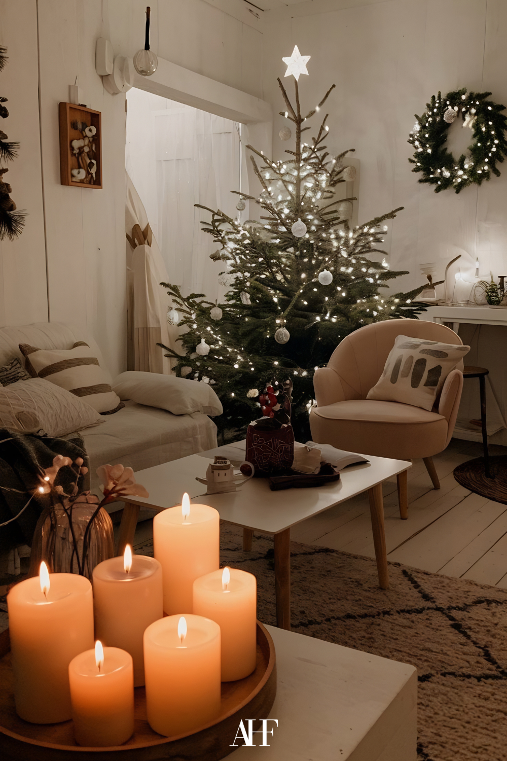 A cozy christmas home with a christmas tree, a large sofa and a coffee table. Cozy small living room with candles as decoration. 