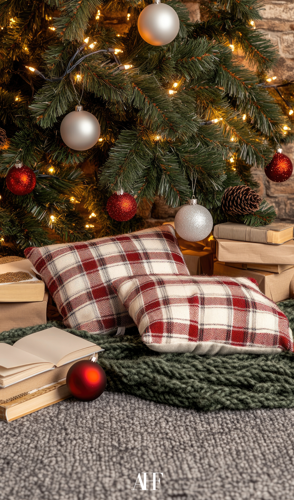 A beautiful Ralph Lauren Christmas decor tree with a checkered pillows in front of it. 