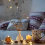 A cozy Christmas home living room with a beige sofa and lots of Christmas decorations.